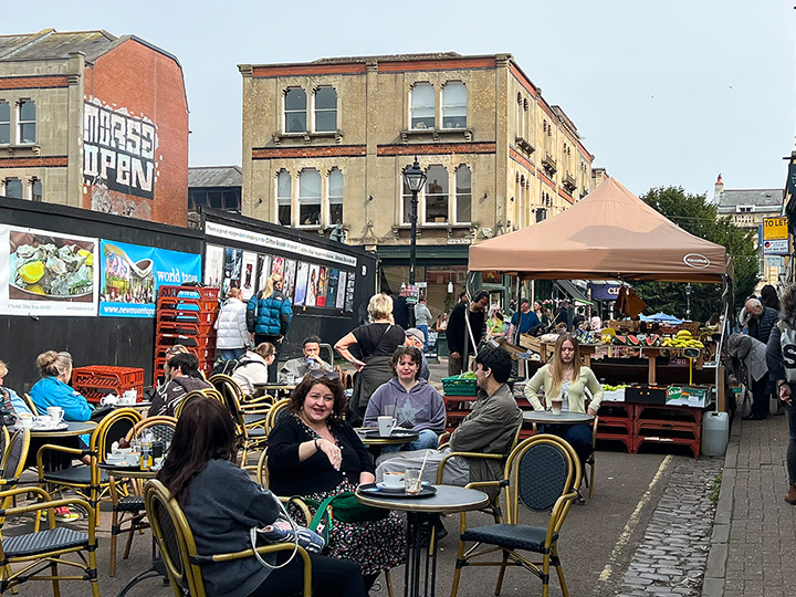 Clifton village over the weekend showing people dining at the various outdoor coffee shops