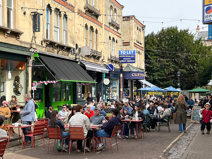 Clifton village over the weekend showing people dining at the various outdoor coffee shops
